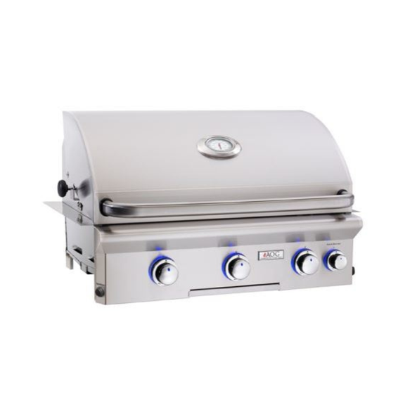 Stainless steel grill with four control knobs on a white background